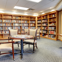 A Room Filled With Furniture And A Book Shelf