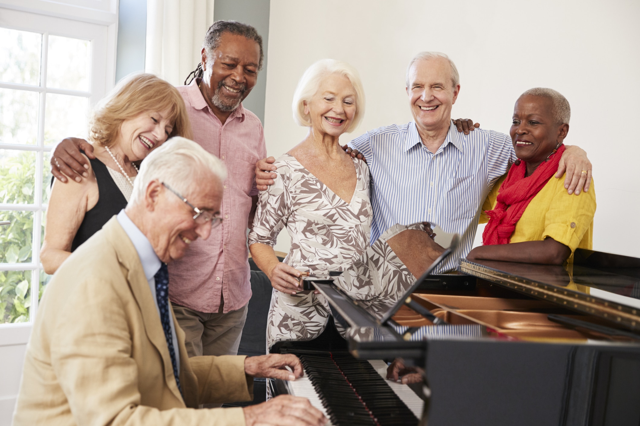 Residents listening to a piano