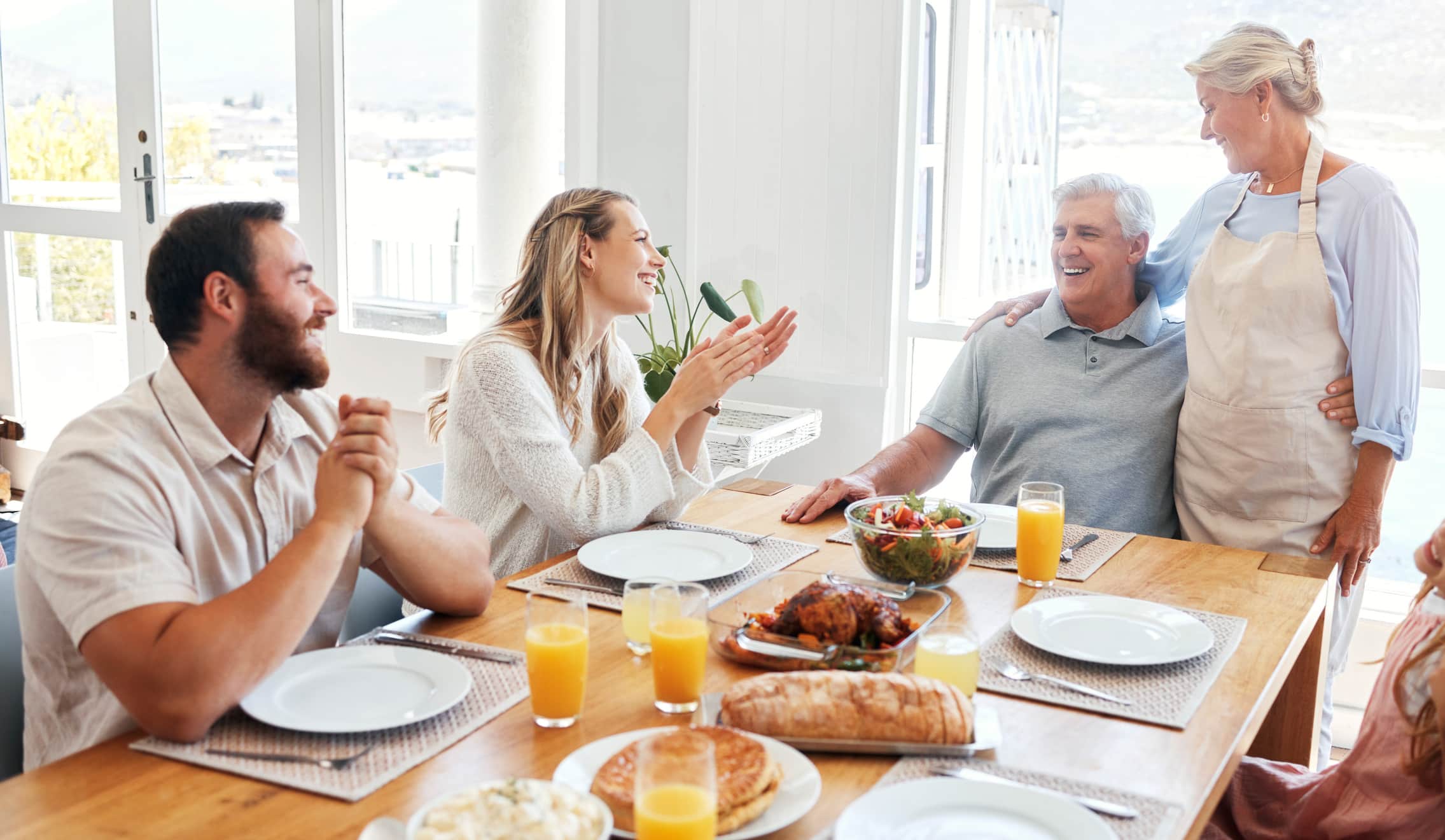 a group of people sitting at a table eating food