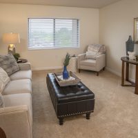 Cozy Living Room With A Stylish Sofa, Decorative Coffee Table, And Warm Lighting, Showcasing The Inviting Atmosphere At One Lincoln Park.